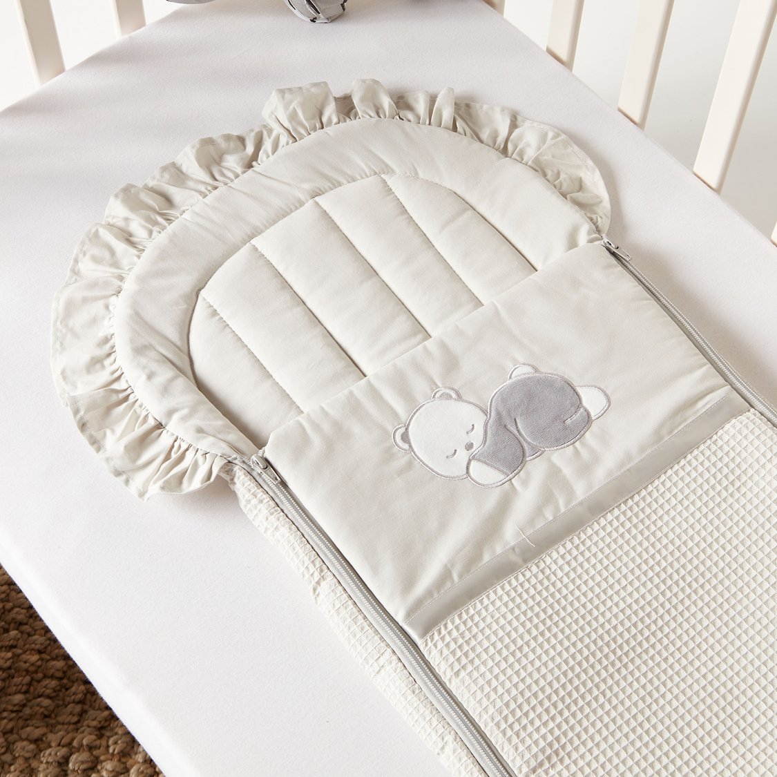 Buy Giggles Bear Applique Nest Bag with Frill Detail from Giggles