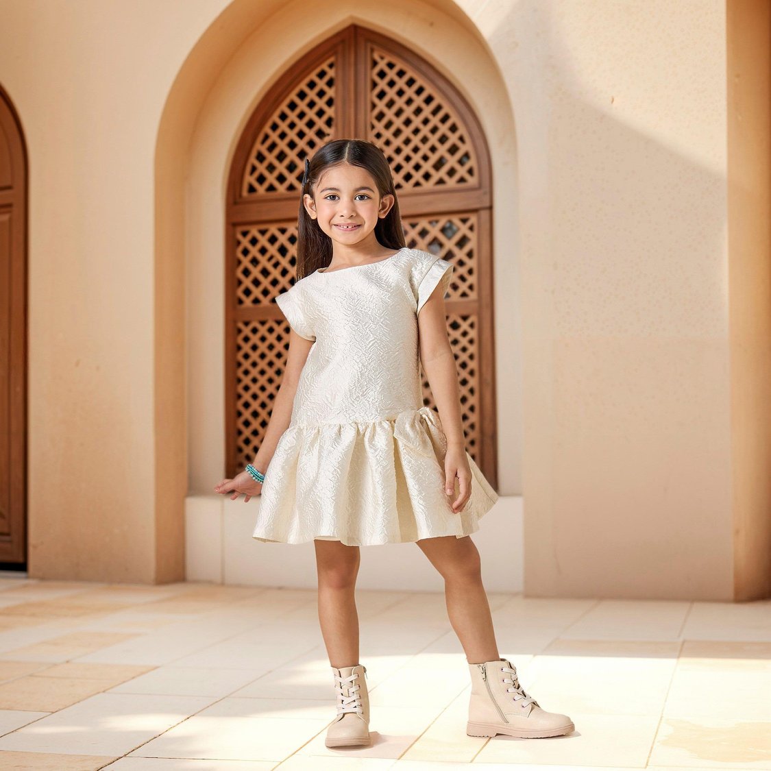 Juniors Textured Dress with Bow Accent and Cap Sleeves