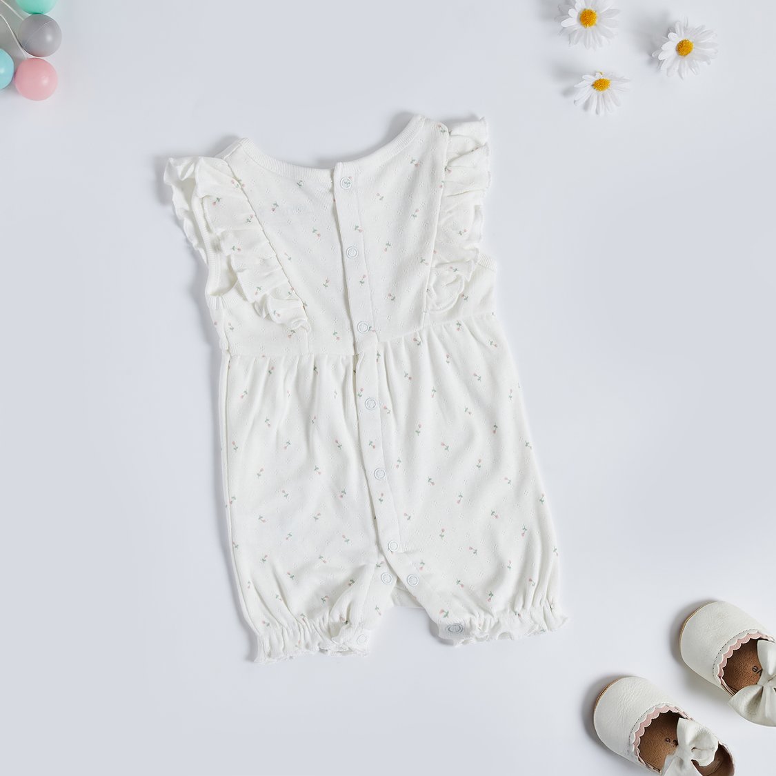 Juniors Floral Textured Romper with Button Closure
