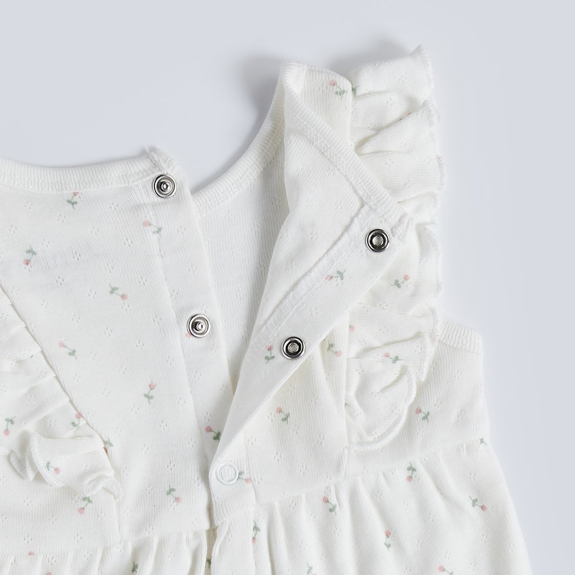 Juniors Floral Textured Romper with Button Closure