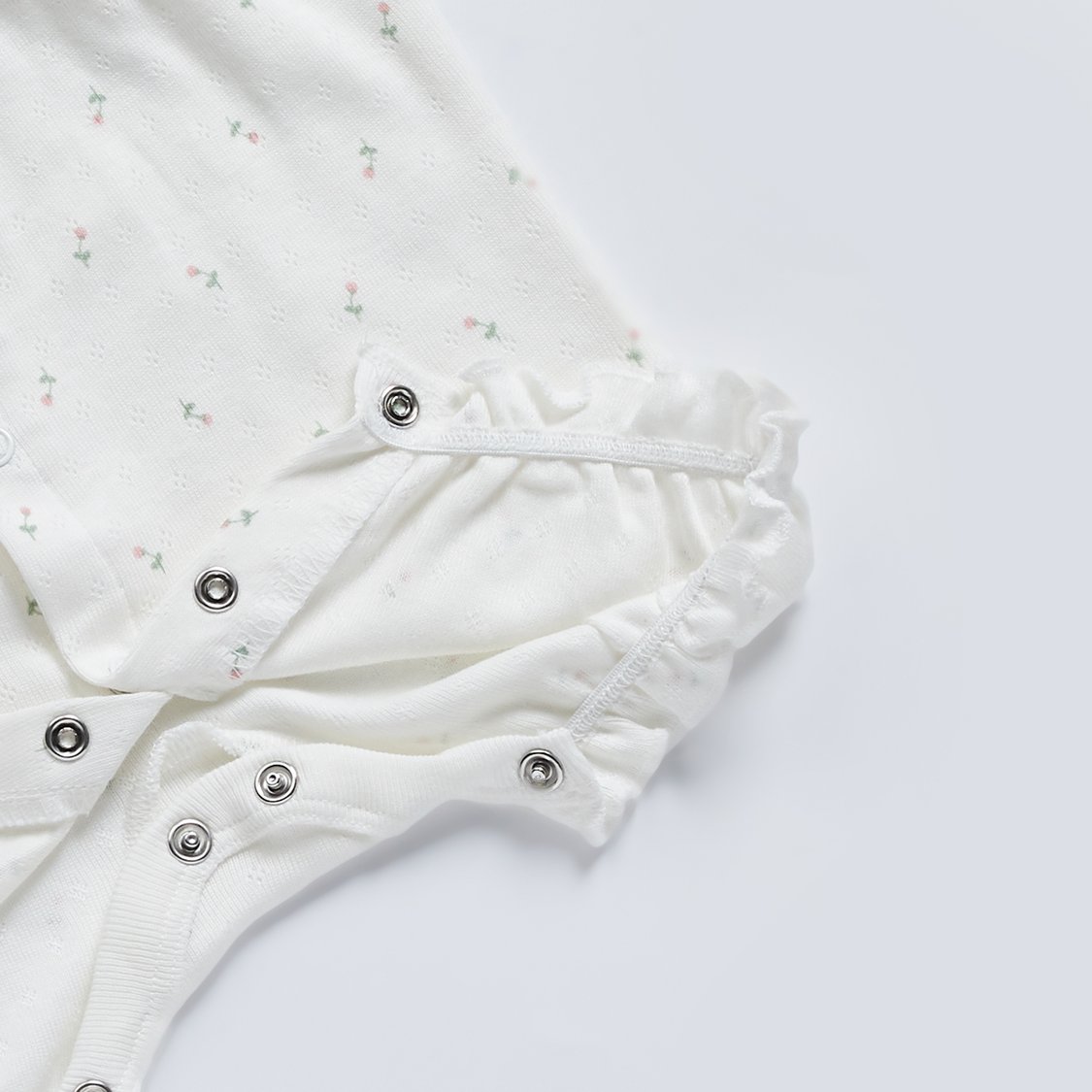 Juniors Floral Textured Romper with Button Closure