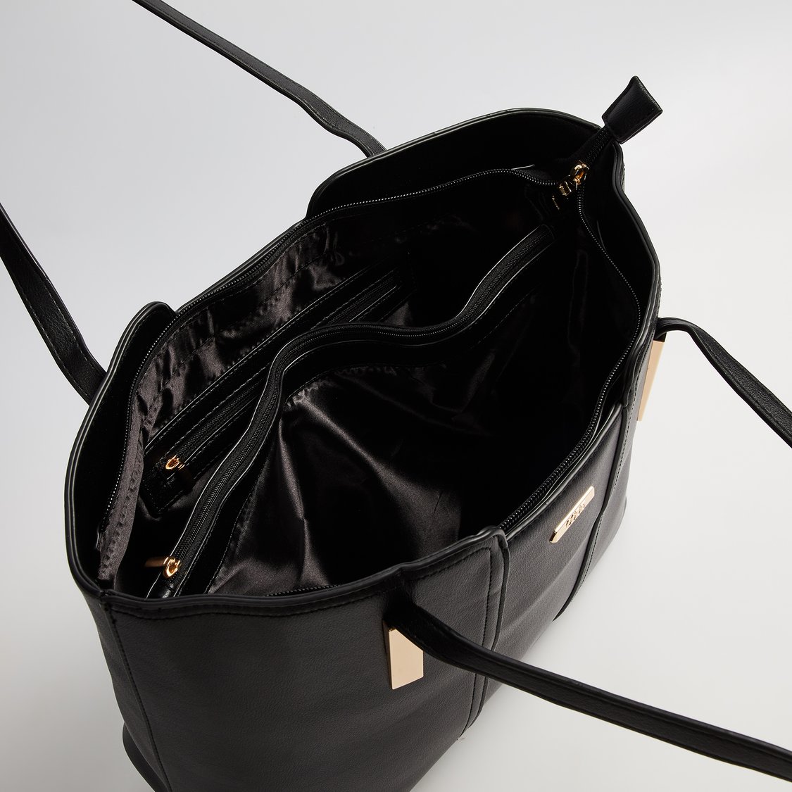 Buy CODE Solid Shoulder Bag from CODE at just INR 1699.0