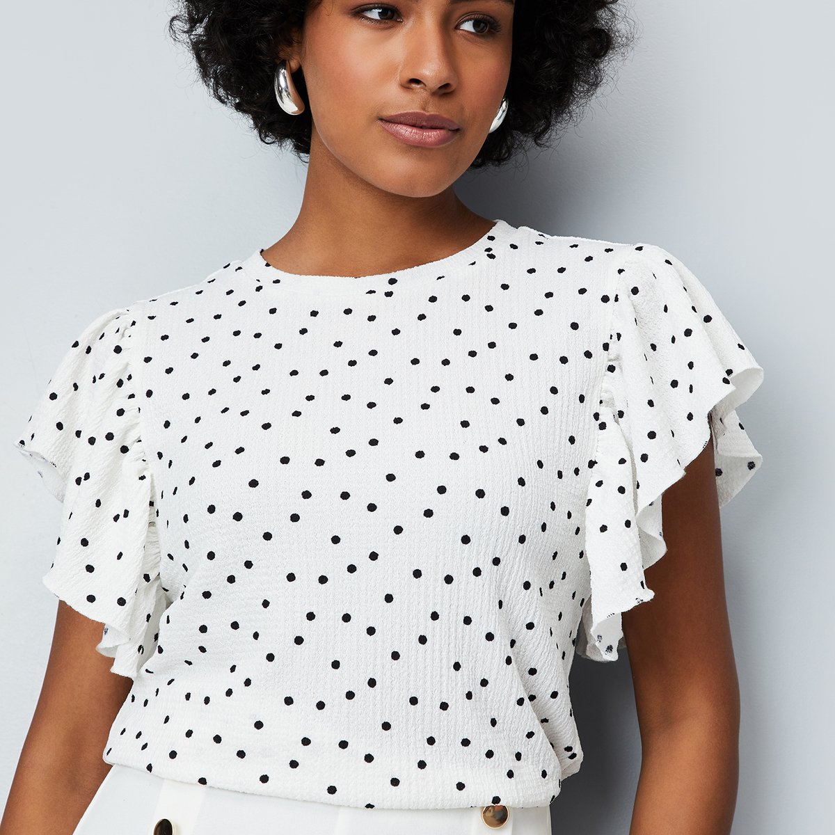 Buy Women Polka Dot Printed Top Online at just Rs. 899.0