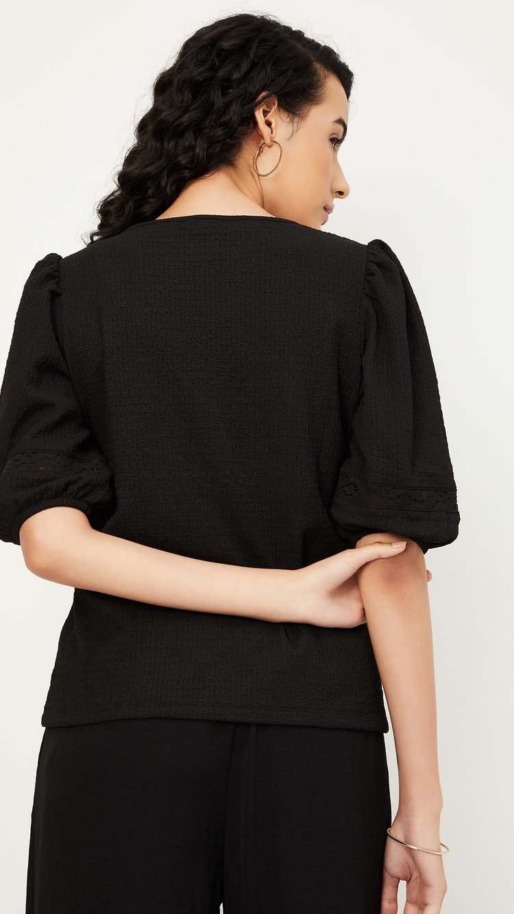 Buy Women Textured Knit Top Online at just Rs. 699.0