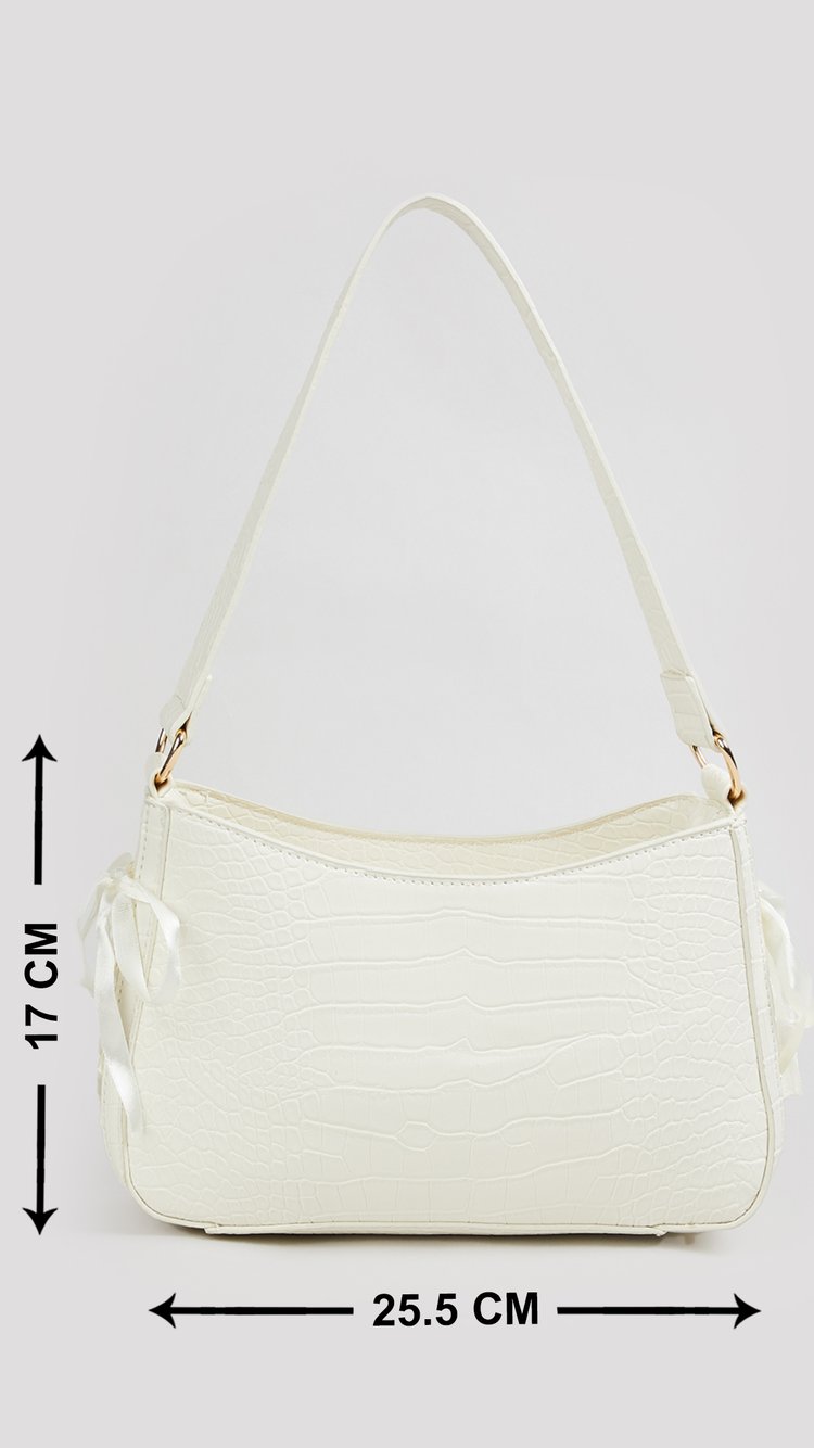 Buy Women Textured Shoulder Bag Online at just Rs. 999.0