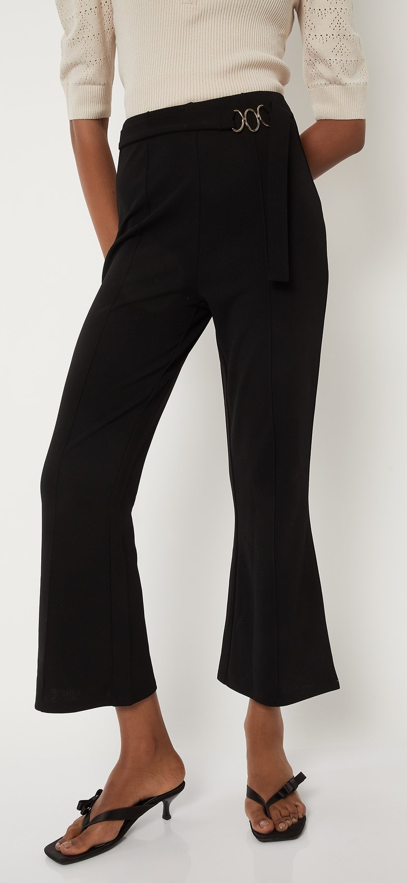 Buy Women Solid Flared Crop Trousers Online at just Rs. 999.0