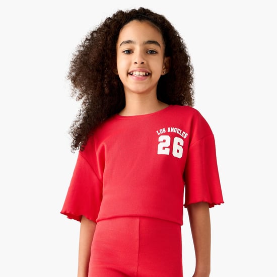 Juniors Varsity Print Round Neck T-shirt with Lettuce Hem