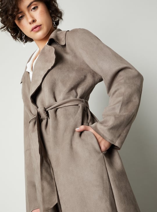 Buy Women Solid Belted Trench Coat Online at just Rs. 2299.0