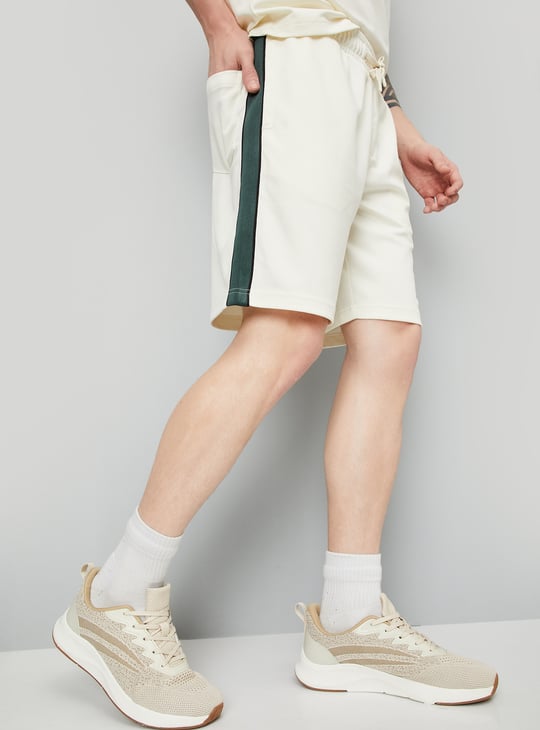 Buy Men Solid Side Taped Shorts Online at just Rs. 699.0