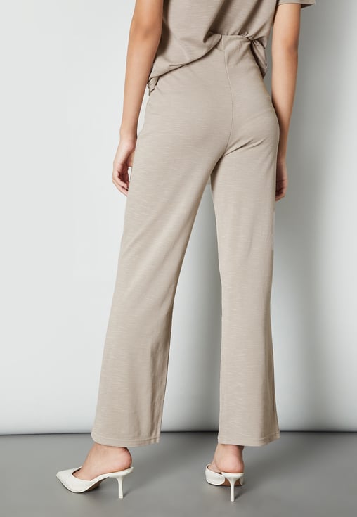 Buy Women Solid Wide Leg Trousers Online at just Rs. 799.0