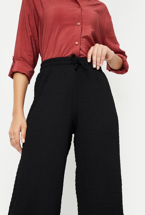 Women Textured Knit Flared Trousers