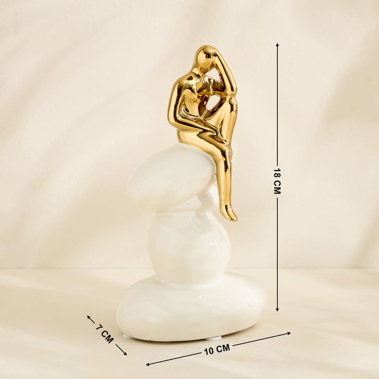 Brighton Amias Ceramic Human Sitting on Rock Figurine