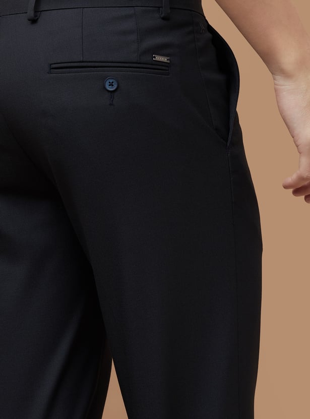 Buy CODE Solid Slim Tapered Formal Trousers from CODE at just INR 999.0