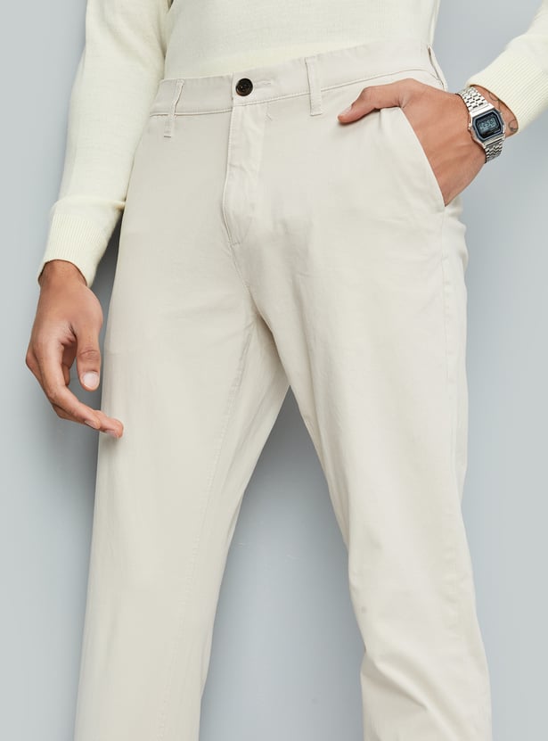 Buy Men Solid Flexi Waist Slim Fit Chinos Online at just Rs