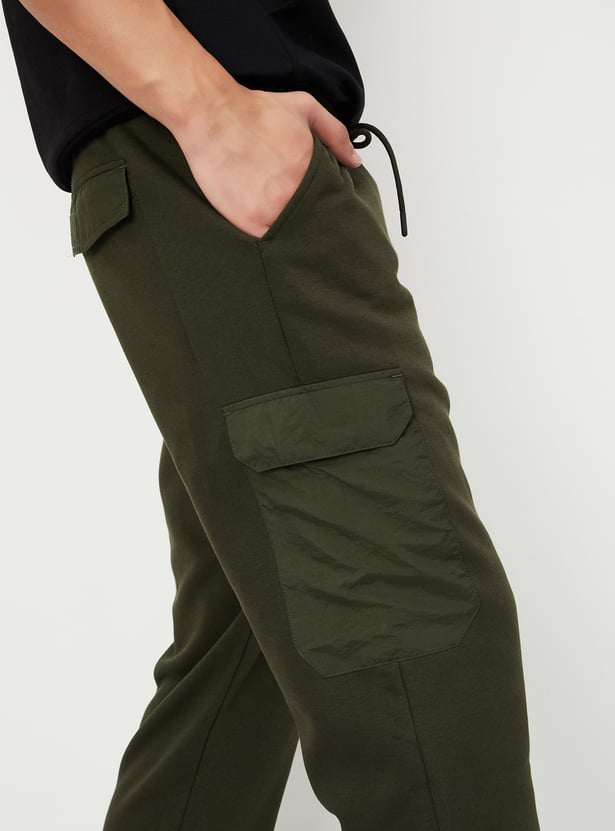 Buy Men Solid Athleisure Cargo Joggers Online at just