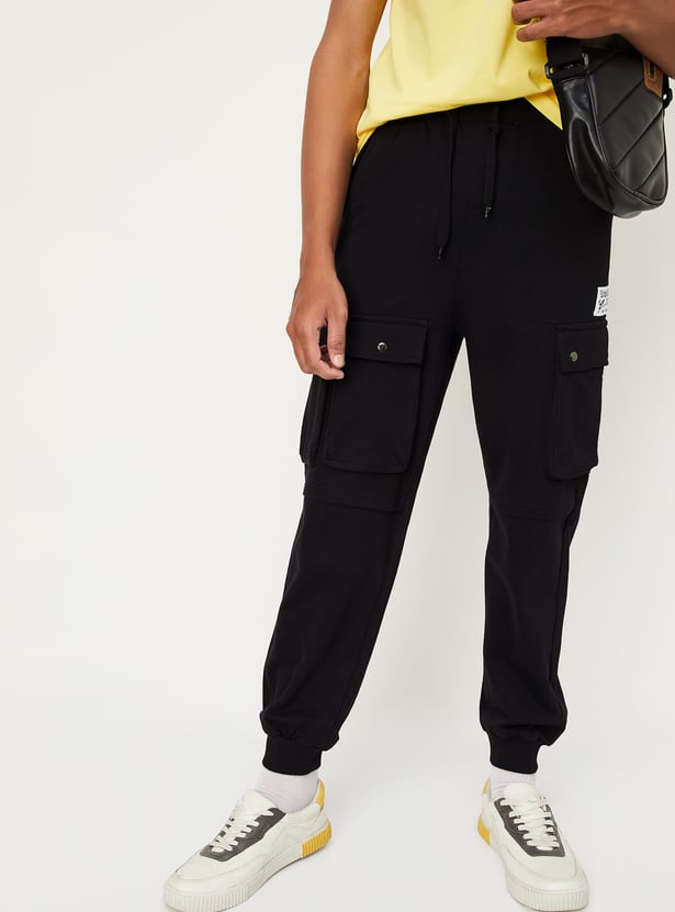 Buy Boys Solid Jogger Trousers with Cargo Pockets Online at just