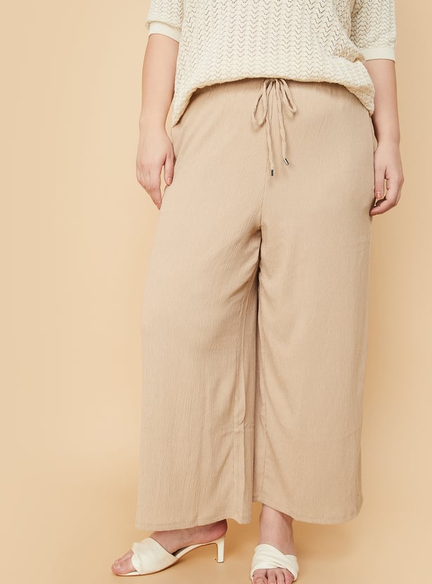 Women Textured Knit Flared Trousers