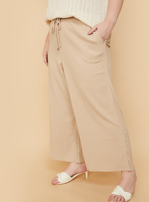 Women Textured Knit Flared Trousers