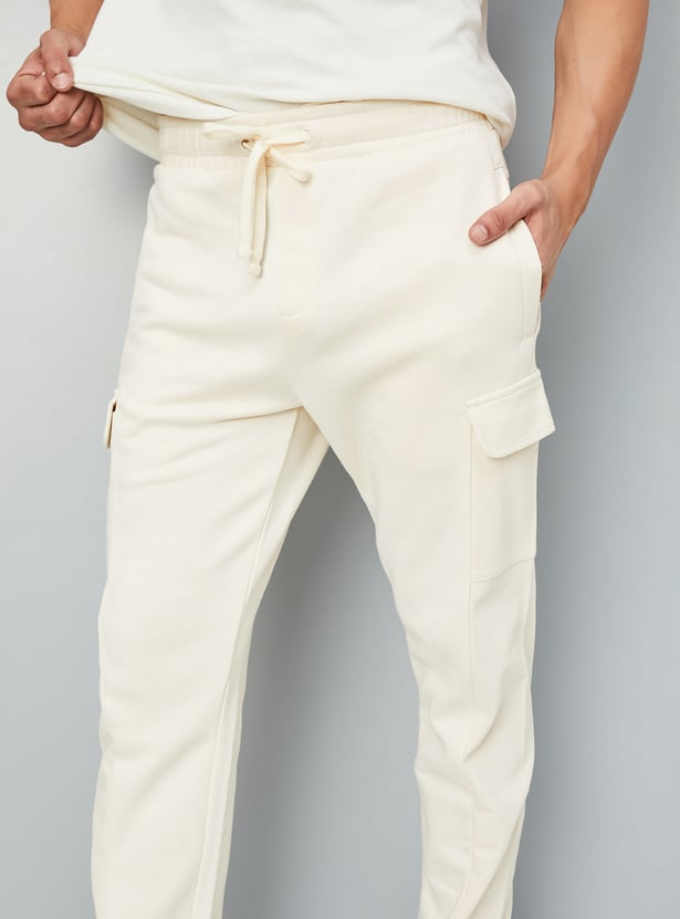 Buy Men Solid Athleisure Track Pants Online at just