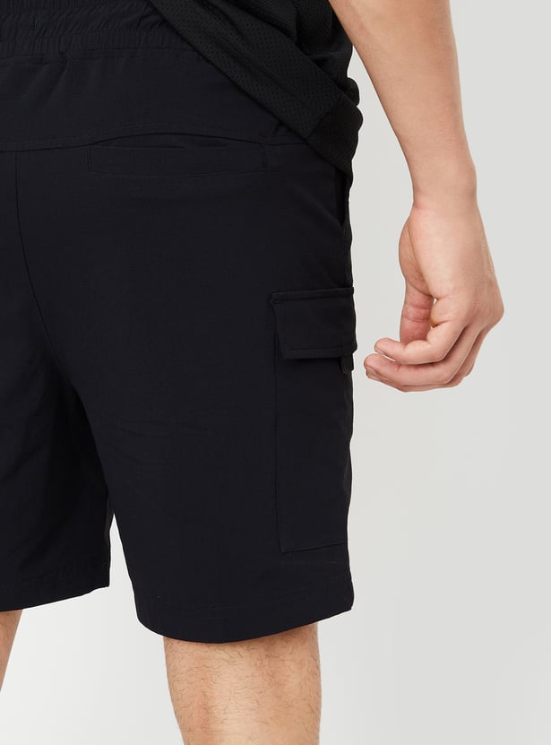 Buy Men Solid Cargo Shorts Online at just