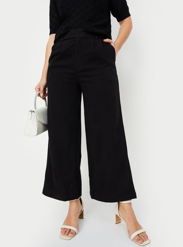 Buy Women Solid Wide Leg Trousers Online at just Rs. 1299.0
