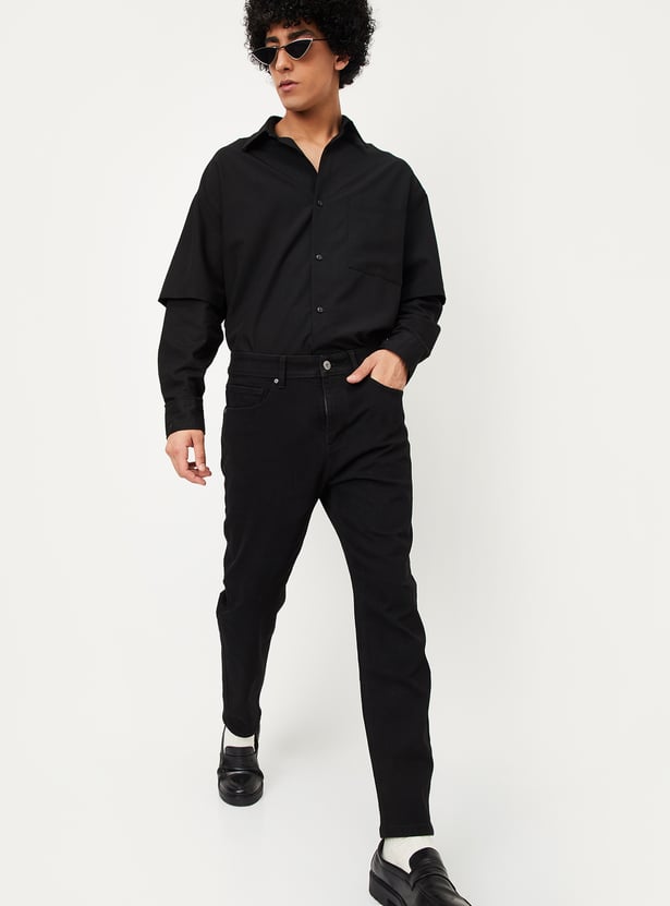 Buy Men Carrot Fit Solid Jeans Online at just Rs. 999.0