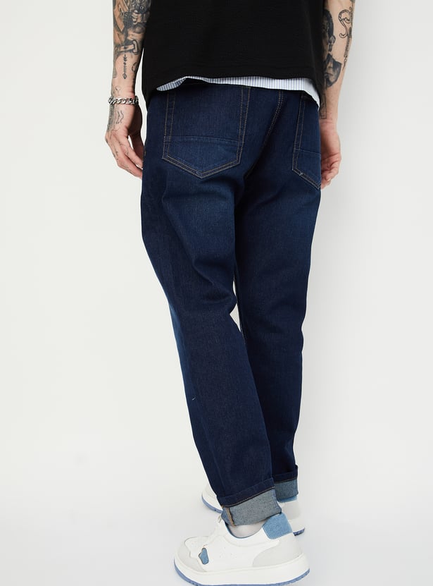 Buy Men Washed Carrot Fit Jeans Online at just Rs. 999.0