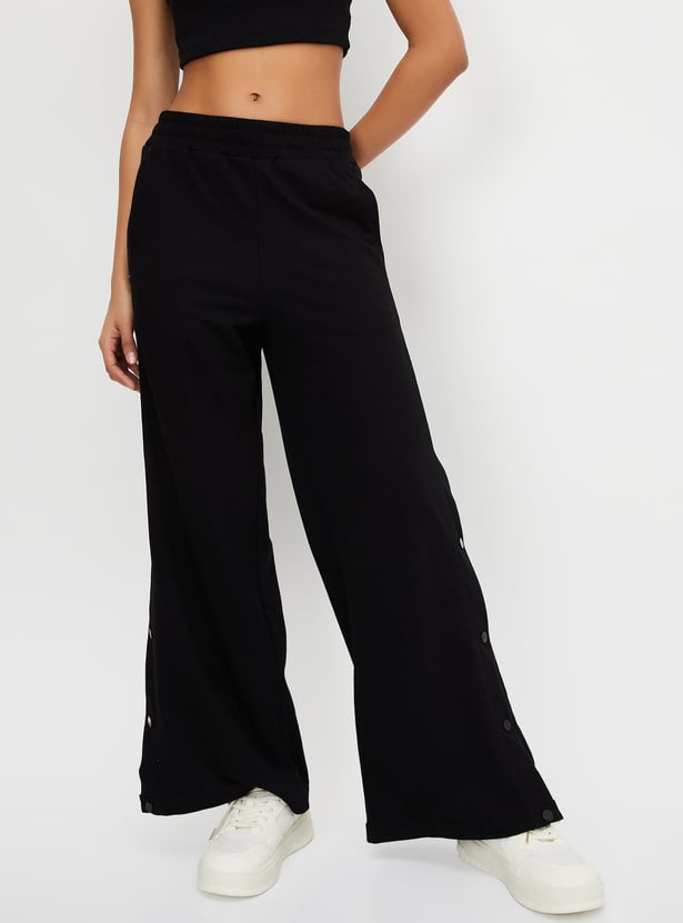 Buy Women Solid Athleisure Wide Leg Track Pants Online at just Rs