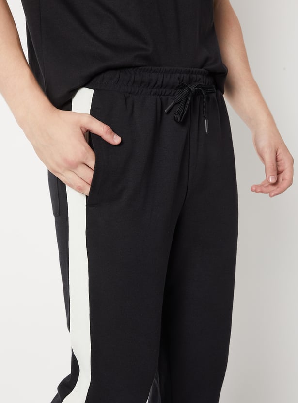 Buy Men Side Taped Sports Track Pants Online at just Rs. 1199.0