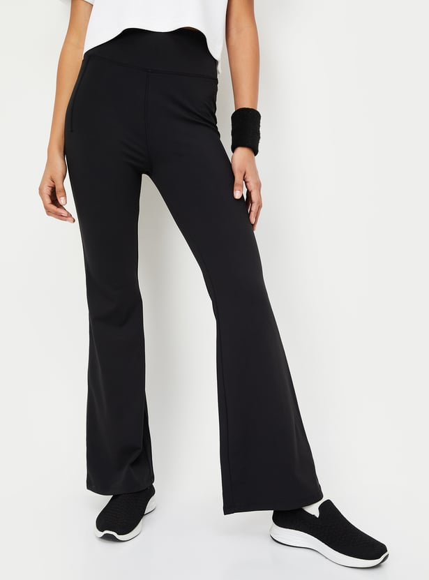 Buy Women Solid Flared Sports Track Pants Online at just Rs. 999.0