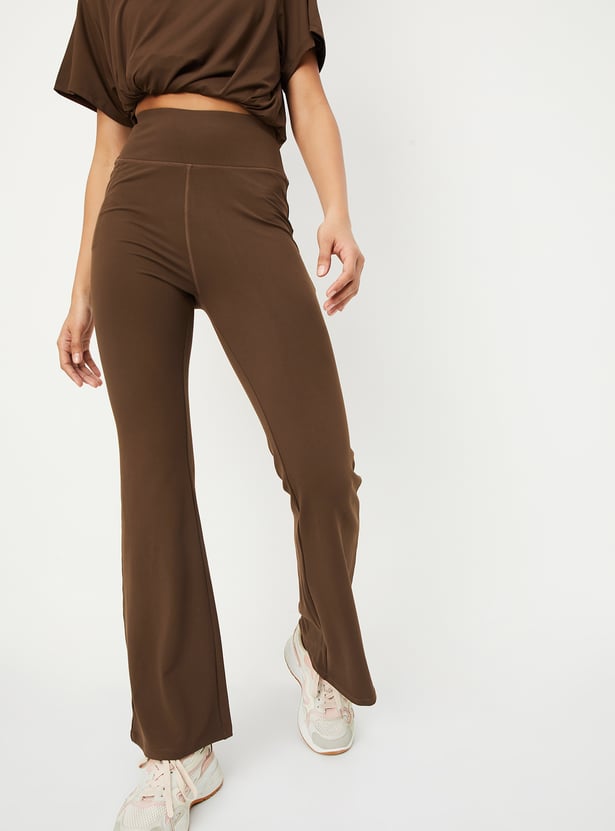 Buy Women Solid Flared Sports Track Pants Online at just Rs. 999.0