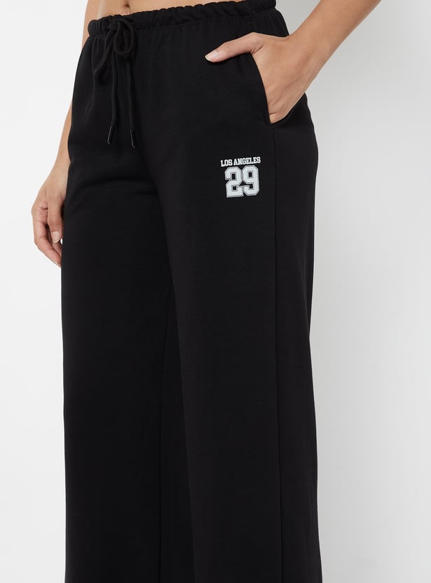 Buy Women Textured Wide Leg Sports Track Pants Online at just Rs