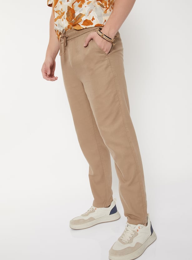 Buy Men Textured Slim Fit Trousers Online at just Rs. 999.0